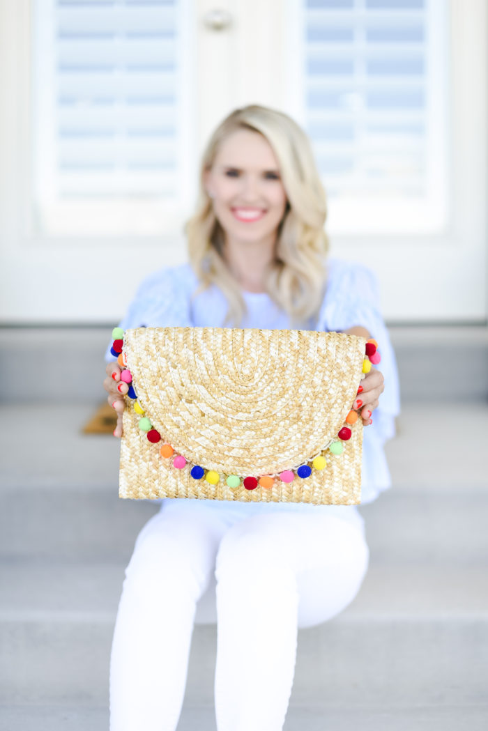 straw clutch with pom poms