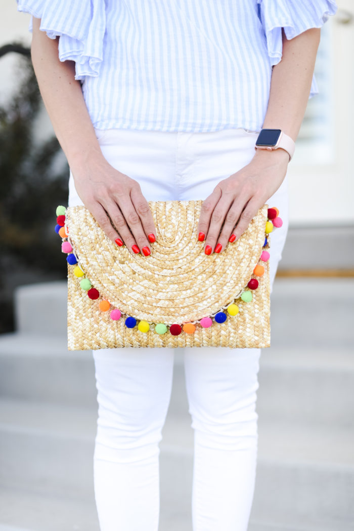 straw clutch with pom poms