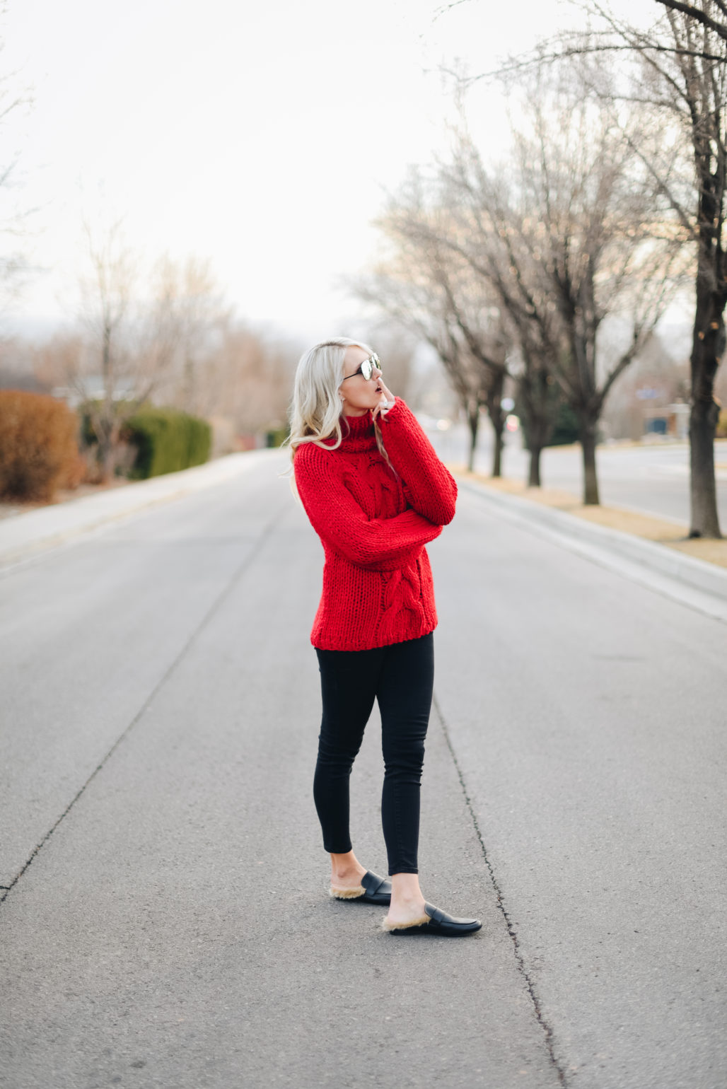 red sweater black pants