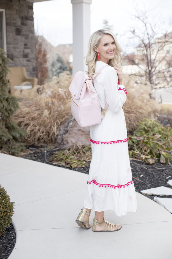 Freshly Picked discount code featured by top Utah life and style blog, A Slice of Style: image of a woman holding a pink Freshly Picked diaper bag