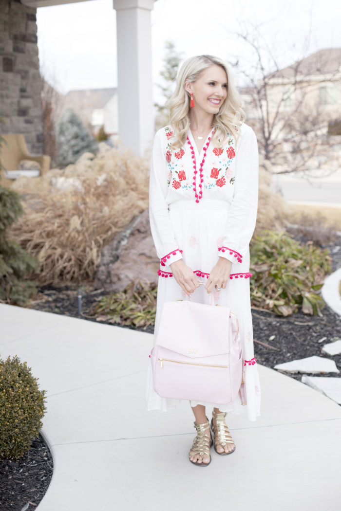 Freshly Picked discount code featured by top Utah life and style blog, A Slice of Style: image of a woman holding a pink Freshly Picked diaper bag