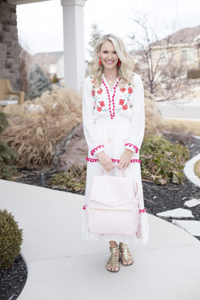 Freshly Picked discount code featured by top Utah life and style blog, A Slice of Style: image of a woman holding a pink Freshly Picked diaper bag