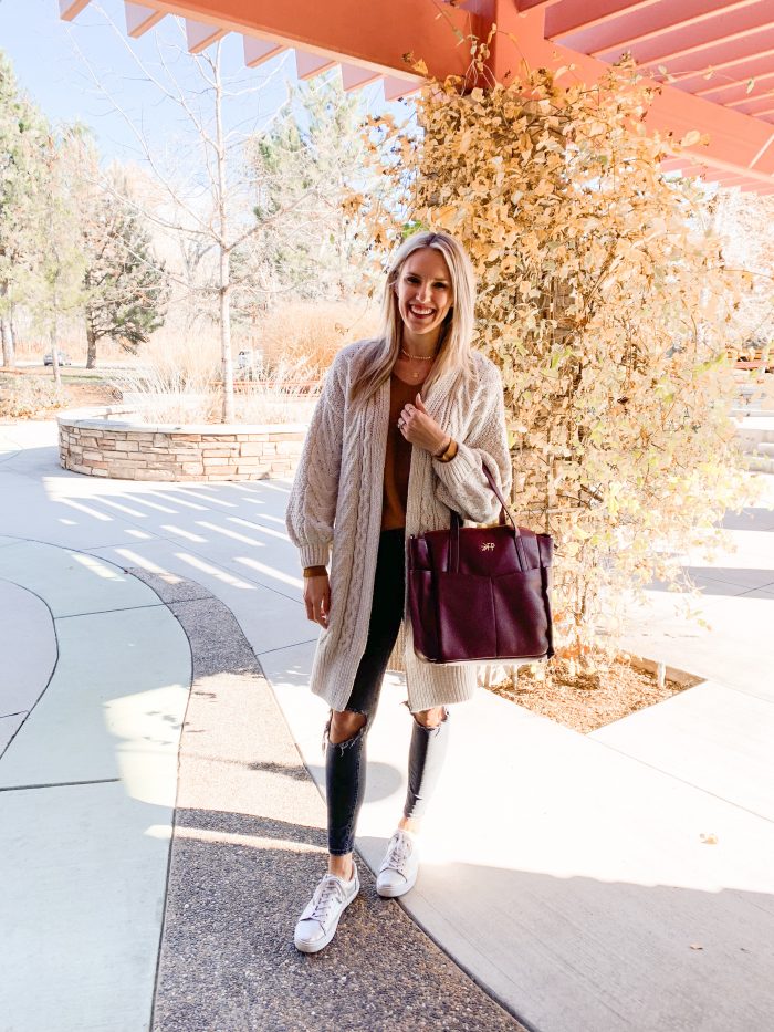 Best Labor Day Sales 2019 by popular Utah fashion blog: image of a woman standing outside and holding the birch Freshly Picked leather bag.