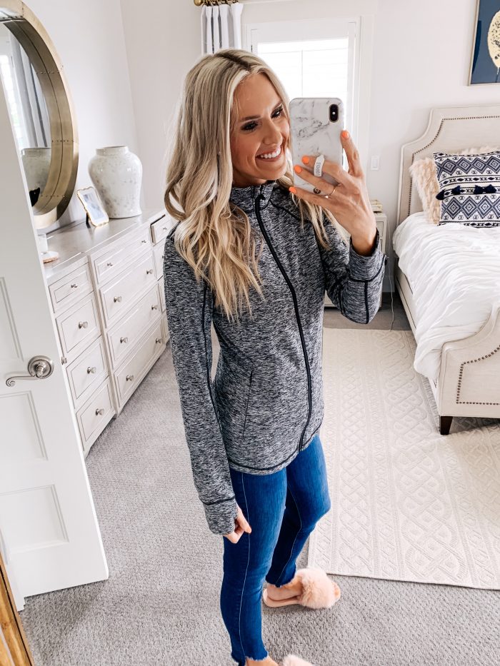 Lululemon dupes found on Amazon featured by top US life and style blog, A Slice of Style: image of a woman wearing CRZ YOGA leggings, CRZ YOGA bra, and Amazon Essentials full zip jacket.