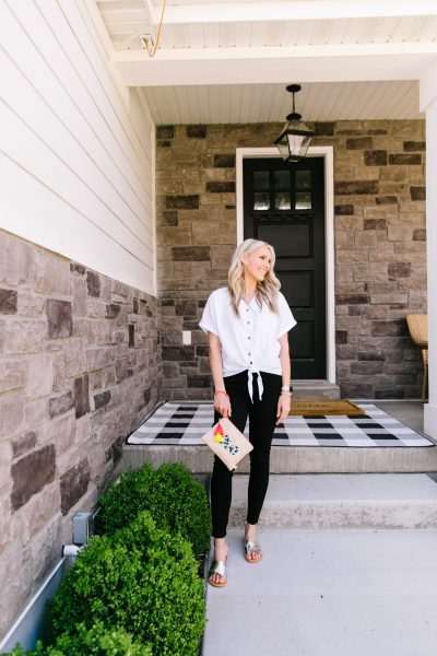 Ev1 Collection at Walmart featured by top US fashion blog, A Slice of Style: image of a woman wearing an EV1 button down blouse, EV1 high rise skinny jeans, Melrose Ave vegan sandals and an EV1 Love pouch, all available at Walmart.