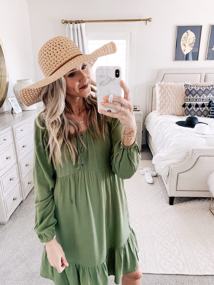 Affordable Walmart fashion favorites featured by top US fashion blog, A Slice of Style: image of a woman wearing a Time and Tru olive midi dress and a sunhat available at Walmart