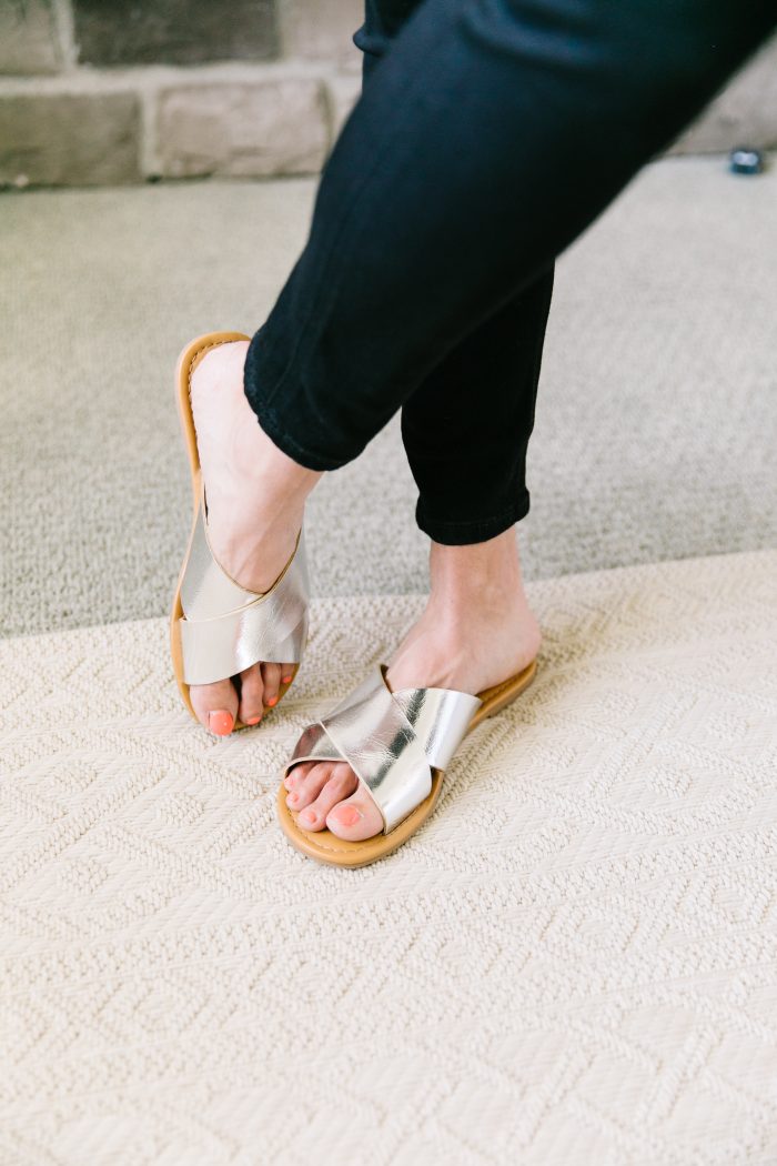 Ev1 Collection at Walmart featured by top US fashion blog, A Slice of Style: image of a woman wearing an EV1 button down blouse, EV1 high rise skinny jeans, Melrose Ave vegan sandals and an EV1 Love pouch, all available at Walmart.