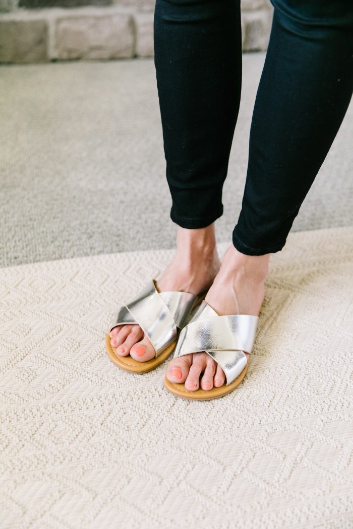 Ev1 Collection at Walmart featured by top US fashion blog, A Slice of Style: image of a woman wearing an EV1 button down blouse, EV1 high rise skinny jeans, Melrose Ave vegan sandals and an EV1 Love pouch, all available at Walmart.