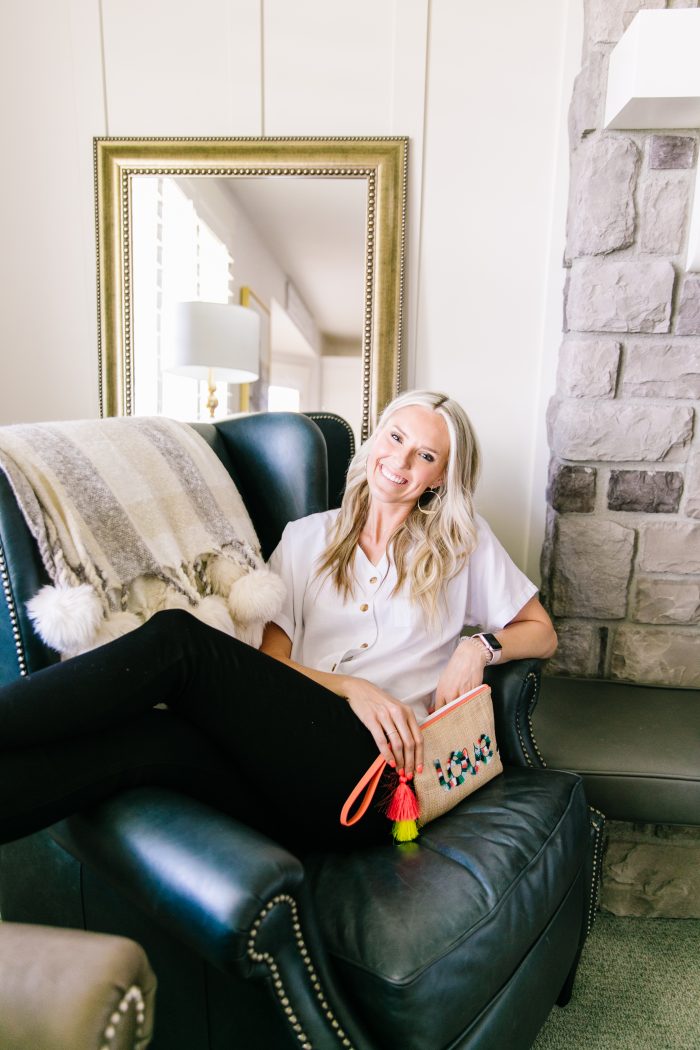 Ev1 Collection at Walmart featured by top US fashion blog, A Slice of Style: image of a woman wearing an EV1 button down blouse, EV1 high rise skinny jeans, Melrose Ave vegan sandals and an EV1 Love pouch, all available at Walmart.