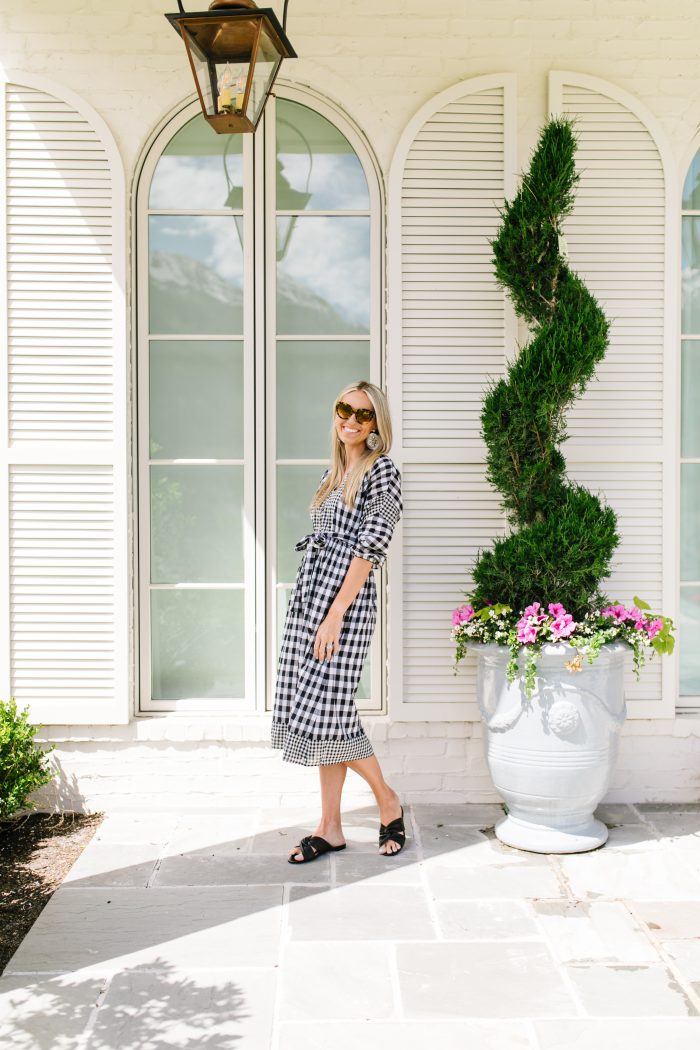 J Crew Summer Style featured by top US life and style blog, A Slice of Style: image of a woman wearing a J crew gingham button up dress, J crew leather sandals, J Crew raffia statement earrings, J Crew straw hat and J Crew oversized sunglasses