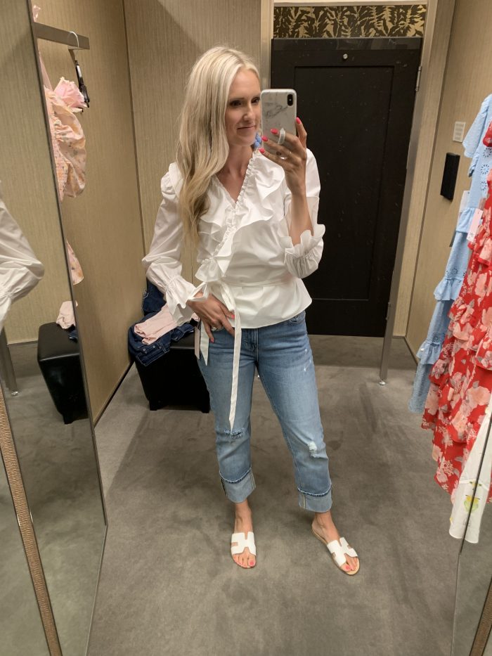 Best Labor Day Sales 2019 by popular Utah fashion blog: image of a woman standing in a dressing room and wearing a Nordstrom Rachel Parcell Ruffle Wrap Top.