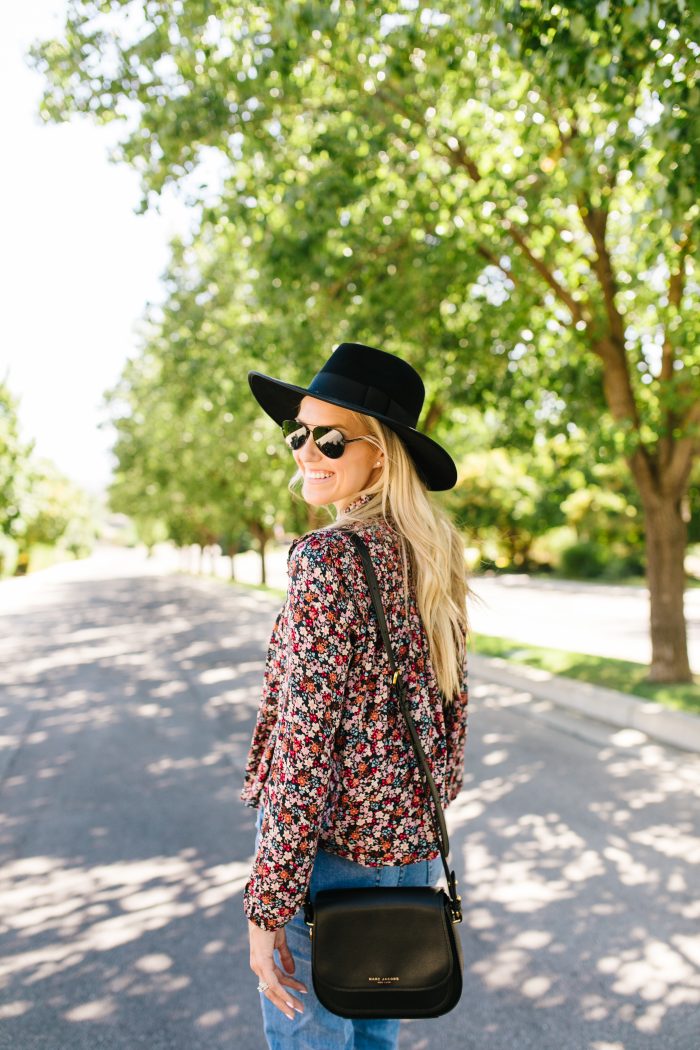 Summer to Fall Transition Pieces from Nordstrom featured by top US life and style blog, A Slice of Style: image of a woman wearing a Rebecca Minkoff crossbody bag, One Print floral blouse, Rachel Parcell girlfriend jeans, Caslon sandals, Polaroid Eyewear aviator sunglasses, and a Brixton felt hat.