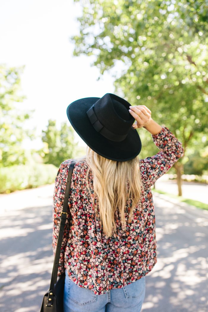 Summer to Fall Transition Pieces from Nordstrom featured by top US life and style blog, A Slice of Style: image of a woman wearing a Rebecca Minkoff crossbody bag, One Print floral blouse, Rachel Parcell girlfriend jeans, Caslon sandals, Polaroid Eyewear aviator sunglasses, and a Brixton felt hat.