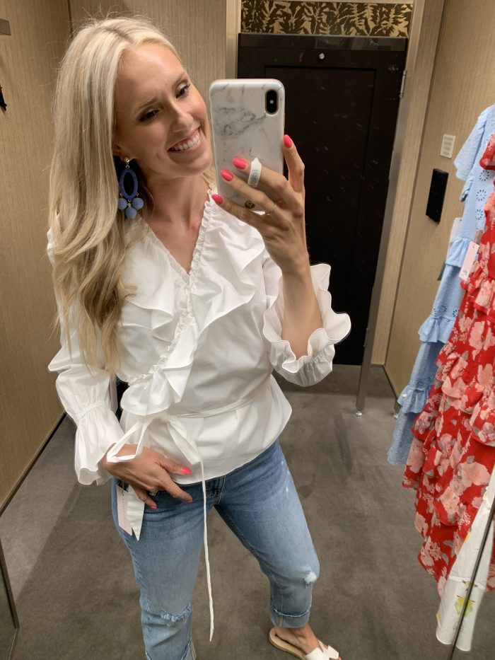 Best Labor Day Sales 2019 by popular Utah fashion blog: image of a woman standing in a dressing room and wearing a Nordstrom Rachel Parcell Ruffle Wrap Top.