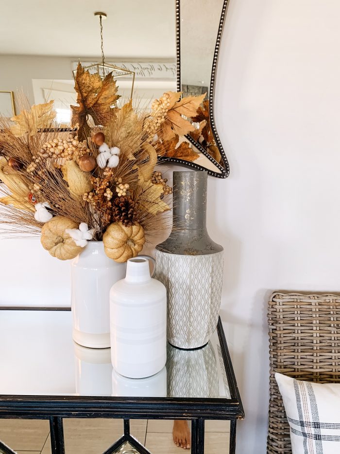 My Home Decorated for Fall! by popular Utah lifestyle blog, A Slice of Style: image of a entry table decorated with white Home Depot Three Hands ceramic vases.