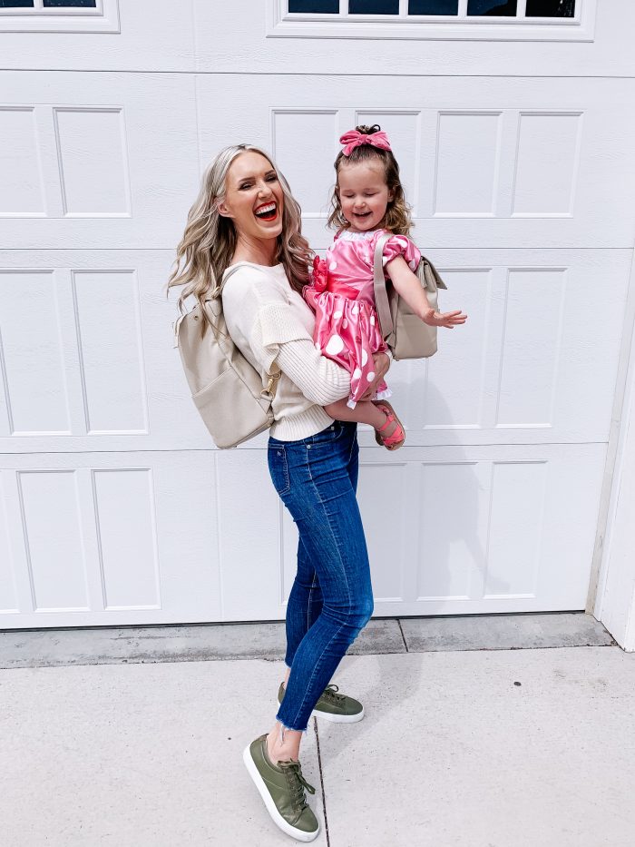 Freshly Picked Coupon Code! by popular Utah fashion blog, A Slice of Style: image of a woman holding her daughter and wearing a Freshly Picked Diaper bag back pack. 