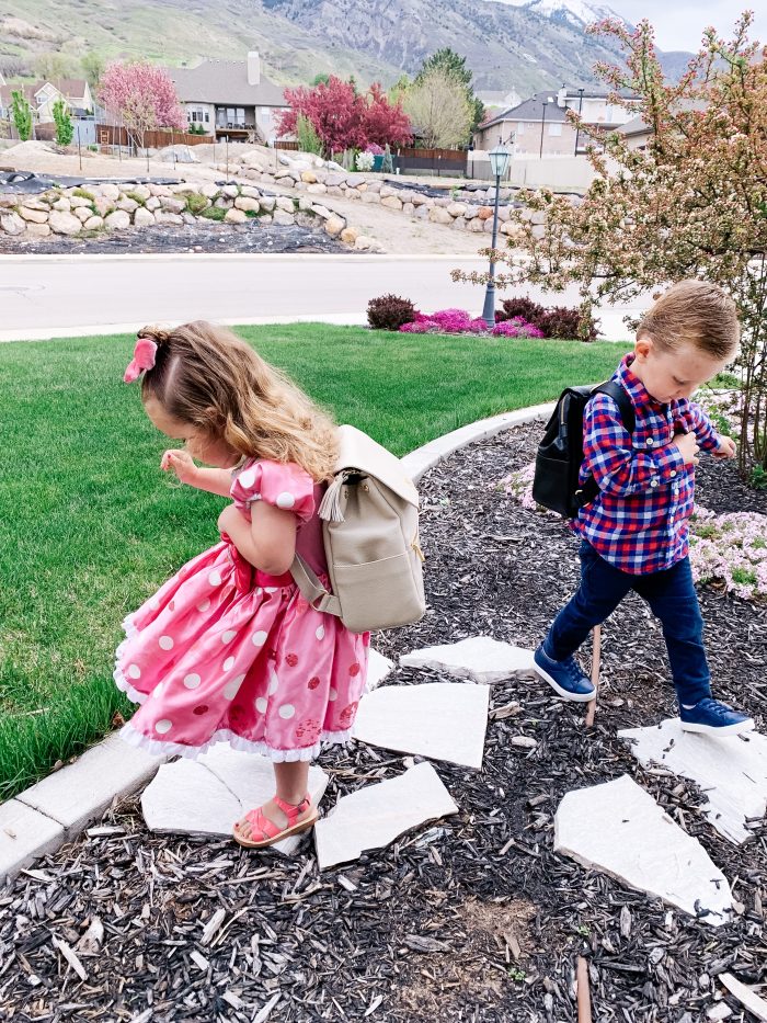 Freshly Picked Coupon Code! by popular Utah fashion blog, A Slice of Style: image of a boy and girl outside wearing Freshly Picked Sandals, Freshly Picked sneakers, and Freshly Picked backpacks. 