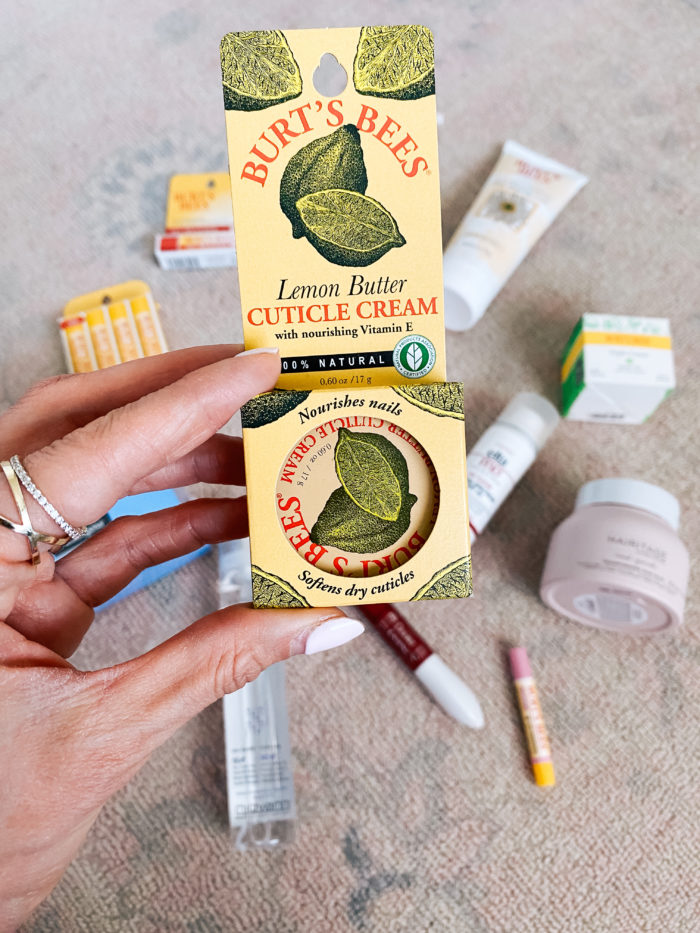 Walmart Beauty Products by popular Utah beauty blog, A Slice of Style: image of a woman holding a Walmart Burt's Bees cuticle cream. 