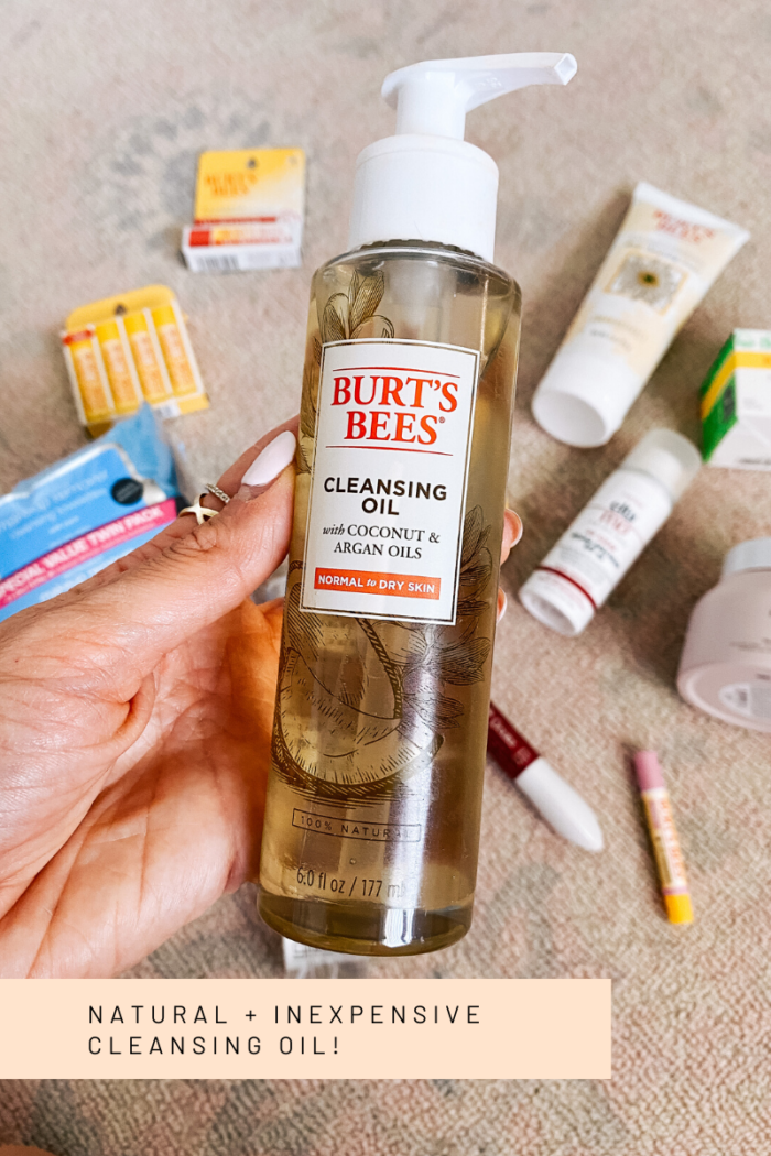 Walmart Beauty Products by popular Utah beauty blog, A Slice of Style: image of a woman holding a bottle of Walmart Burt's Bees cleansing oil. 