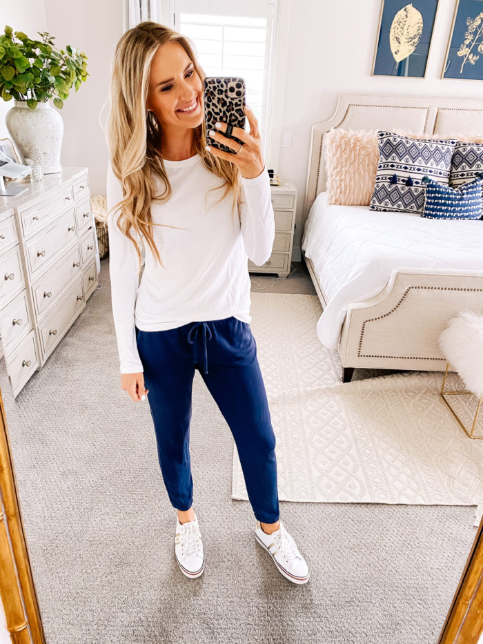 Amazon fashion haul for women | Amazon Fashion Haul by popular Utah fashion blog, A Slice of Style: image of a woman wearing a Amazon Essentials Women's Classic-Fit Long-Sleeve Crewneck T-Shirt, blue joggers, and Amazon Tommy Hilfiger Fentii sneakers. 