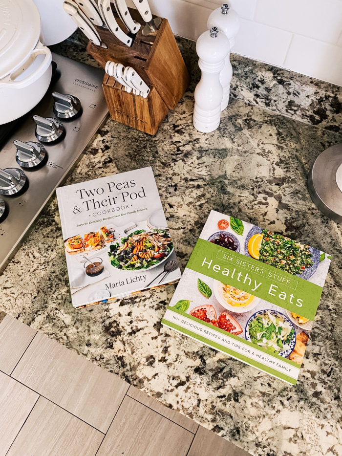 Best Kitchen Tools by popular Utah lifestyle blog, A Slice of Style: image of Two Peas & Their Pod cookbook and Six Sisters Stuff Healthy Eats cookbook on a granite countertop. 