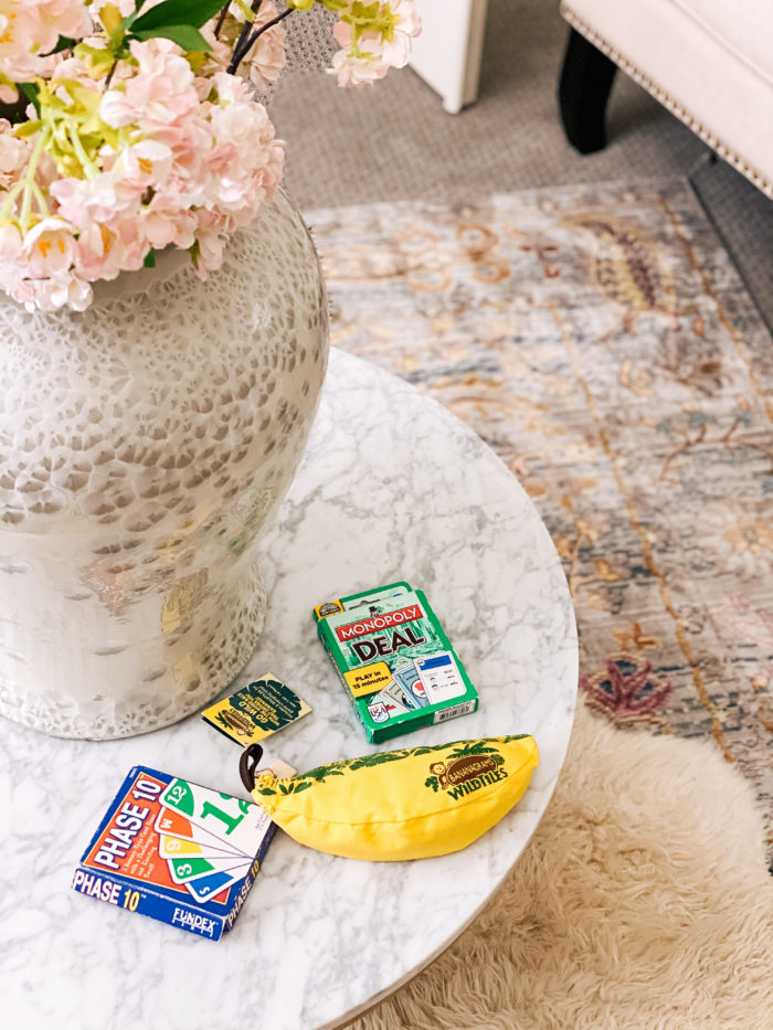 2-player games |  2 Player Games by popular Utah lifestyle blog, A Slice of Style: Pinterest image of Phase 10, Monopoly Deal, and Bananagram wild tiles on a marble coffee table. 