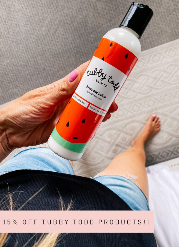 Tubby Todd Discount Code by popular Utah motherhood blog, A Slice of Style: image of a woman holding a bottle of Tubby Todd Everyday Lotion. 