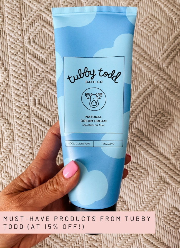 Tubby Todd Discount Code by popular Utah motherhood blog, A Slice of Style: image of a woman holding a bottle of Tubby Todd Natural Dream Cream. 