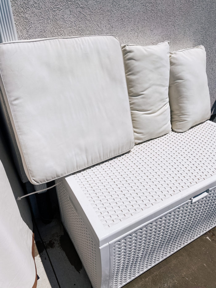 White Outdoor Cushions by popular Utah life and style blog, A Slice of Style: image of a white outdoor storage box. 