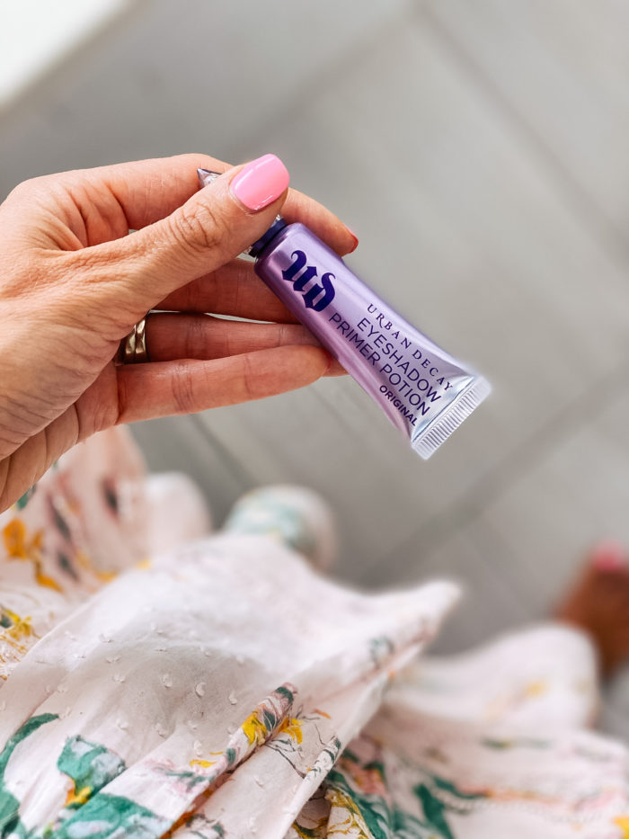 Nordstrom Beauty by popular Utah beauty blog, A Slice of Style: image of Jenica Parcell holding a Urban Decay eyeshadow primer potion. 