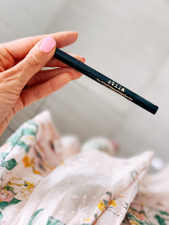 Nordstrom Beauty by popular Utah beauty blog, A Slice of Style: image of Jenica Parcell holding some stila waterproof liquid eyeliner. 