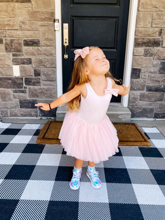 Back to School Fashion with Walmart featured by top Utah lifestyle blogger, A Slice of Style. | Walmart Back to School by popular Utah lifestyle blog, A Slice of Style: image of a little girl wearing a pair of Walmart Wonder Nation Athletic Iridescent High-Top Sneakers and a pink tutu. 