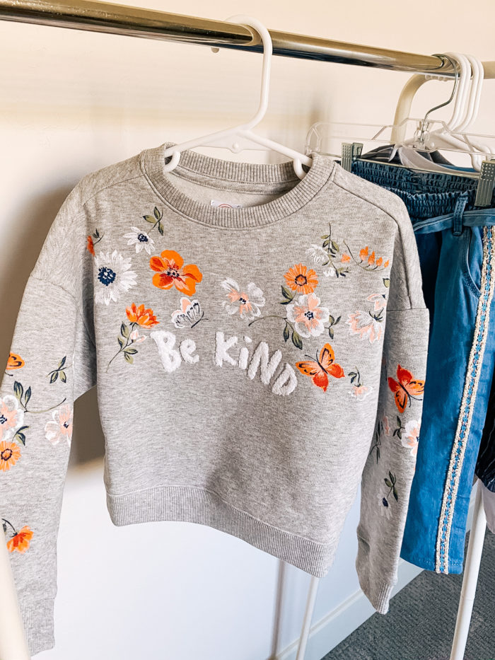 Back to School Fashion with Walmart featured by top Utah lifestyle blogger, A Slice of Style. | Walmart Back to School by popular Utah lifestyle blog, A Slice of Style: image of a Walmart Wonder Nation Girls Be Kind Floral Crewneck Pullover Sweatshirt.