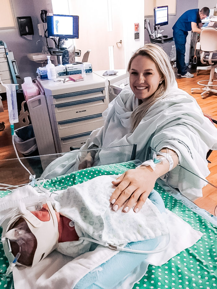 4th Birthday Party by popular Utah motherhood blog, A Slice of Style: image of Jenica Parcell sitting by her newborn baby in the hospital. 