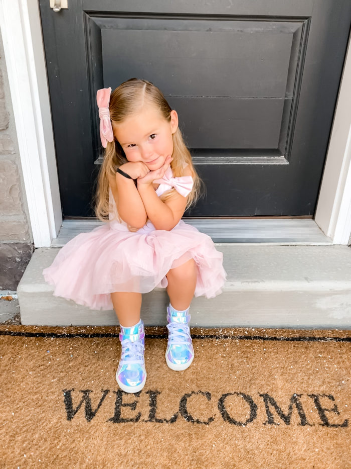 Back to School Fashion with Walmart featured by top Utah lifestyle blogger, A Slice of Style. | Walmart Back to School by popular Utah lifestyle blog, A Slice of Style: image of a little girl wearing a pair of Walmart Wonder Nation Athletic Iridescent High-Top Sneakers and a pink tutu. 