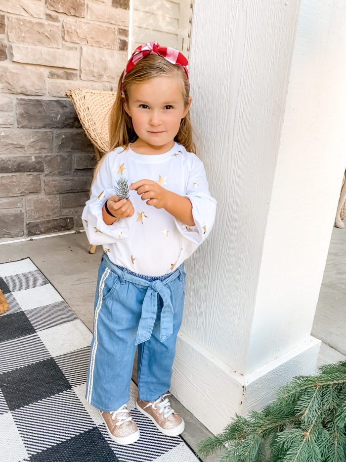 Back to School Fashion with Walmart featured by top Utah lifestyle blogger, A Slice of Style. | Walmart Back to School by popular Utah lifestyle blog, A Slice of Style: image of a little girl wearing a Walmart Wonder Nation Girls Long Sleeve Foil Tie-Front Top, Walmart Wonder Nation Baby Toddler Girl Belted Wide Leg Cropped Jeans, and Walmart Wonder Nation Casual Bump Toe Sneaker.