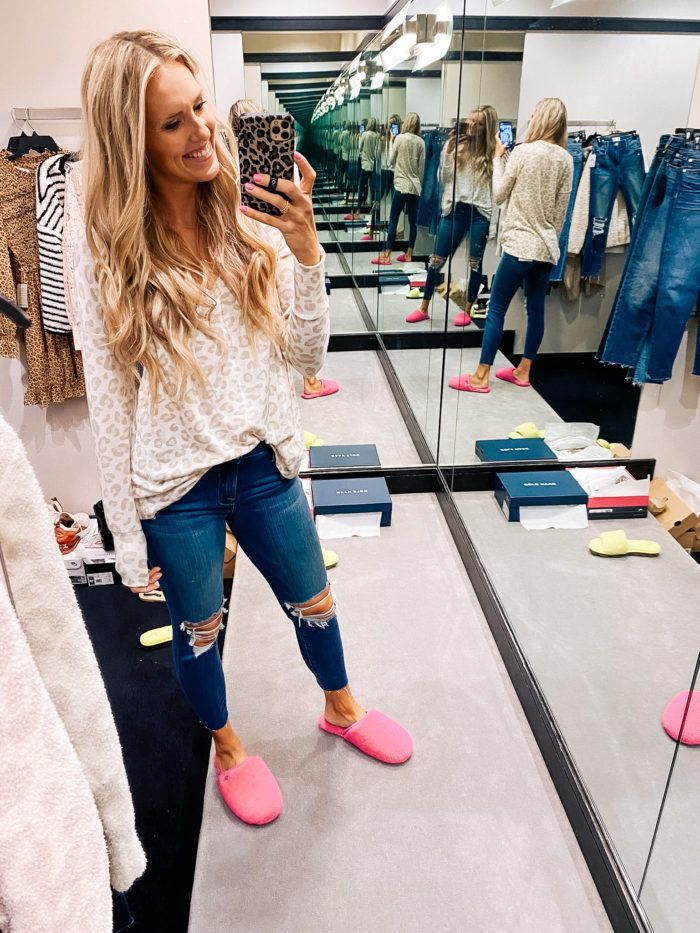 Nordstrom Anniversary Sale by popular Utah fashion blog, A Slice of Style: image of Jenica Parcell wearing a Nordstrom leopard print sweater, distressed denim, and pink UGG slippers. 