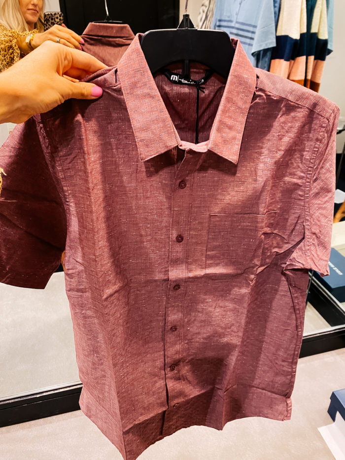 Nordstrom Anniversary Sale by popular Utah fashion blog, A Slice of Style: image of Jenica Parcell holding a TravisMathew red button up shirt.