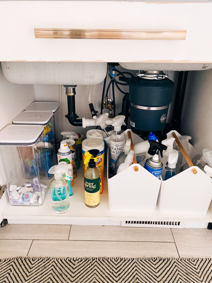 toxin-free home | Branch Basics Reviews by popular Utah lifestyle blog, A Slice of Style: image of various cleaning solutions under a kitchen sink. 